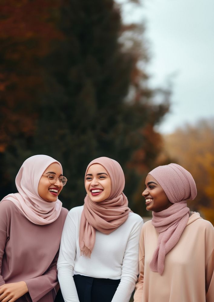 3 muslim women laughing adult scarf. 