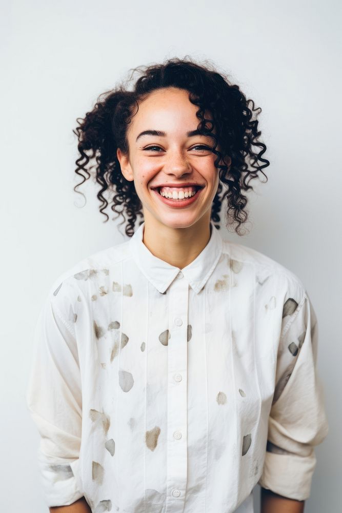 Woman standing laughing smiling. 