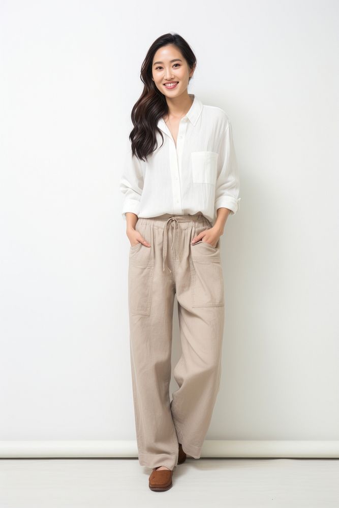 Asian woman standing smiling blouse. AI generated Image by rawpixel.
