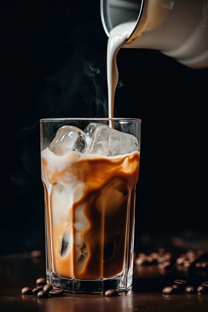 Iced coffee pouring drink milk. 