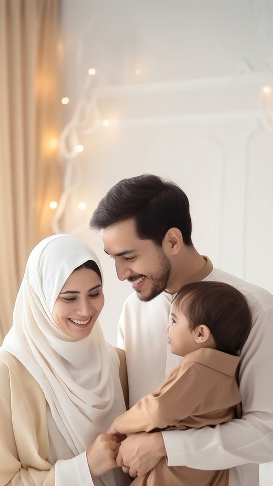 Happy Muslim family reading quran together baby affectionate togetherness. 