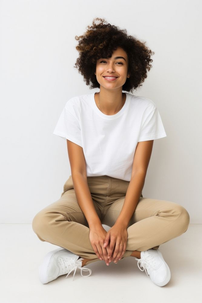 Black woman sitting smiling sleeve. AI generated Image by rawpixel.