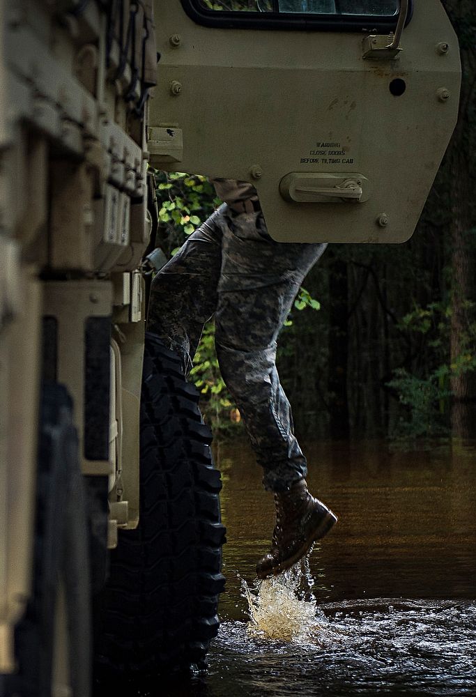 Flood water from the Edisto River quickly rose during high tide, while South Carolina National Guard Soldiers helped…