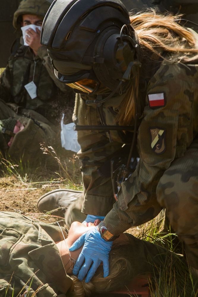 A Polish soldier renders medical aid to a simulated casualty during Anakonda 2016 at Konotop Range in Drawsko Promorskie…