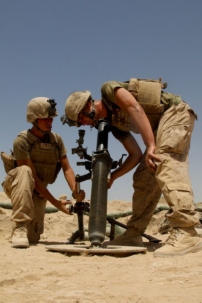 U.S. Marines conduct weapons drills to maintain proficiency at a forward operating base in the Nawa district of the Helmand…