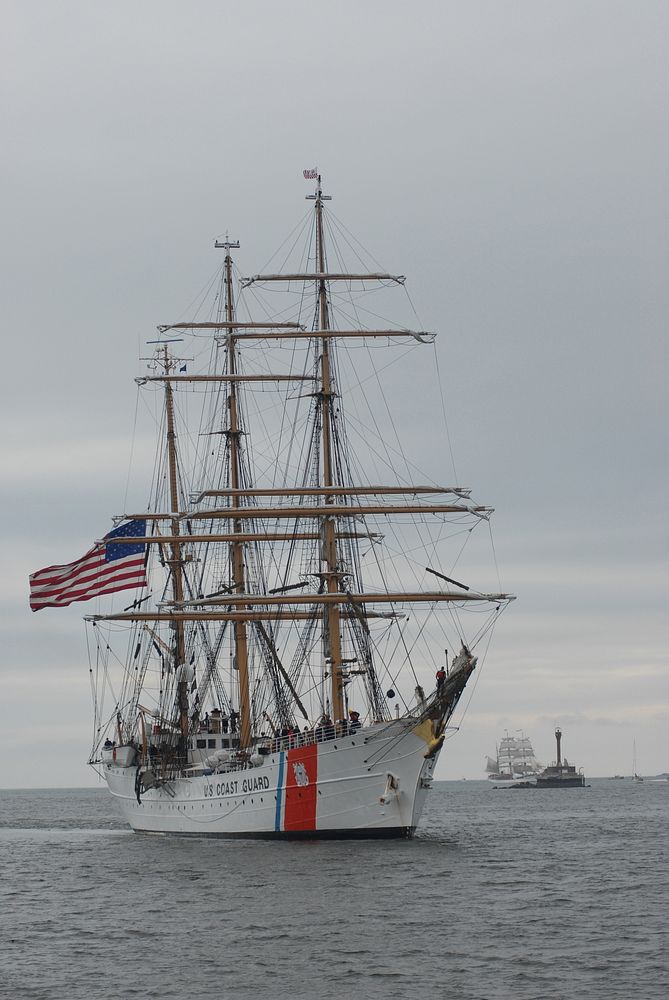 From left, USCGC Eagle (WIX 327) and the Canadian sail training ship Picton Castle make their way toward Boston Harbor in…