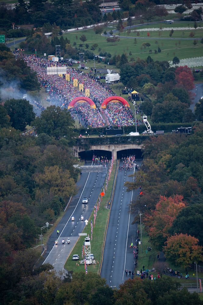 Participants from around the world take part in the 43rd annual running of the Marine Corps Marathon, traveling on a…