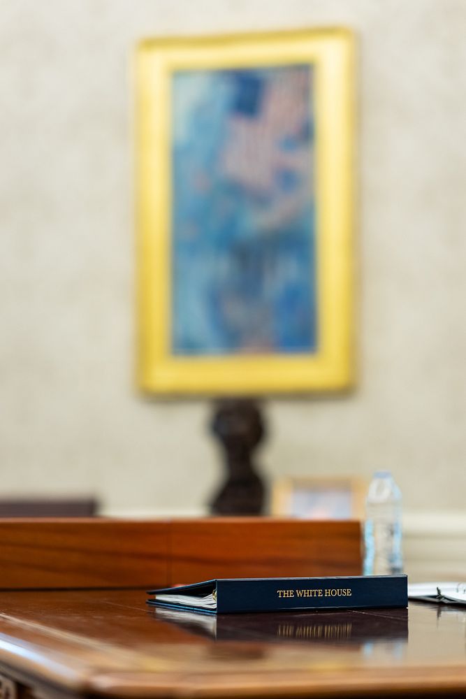 A binder sits on the Resolute Desk, Thursday, July 22, 2021, in the Oval Office of the White House.