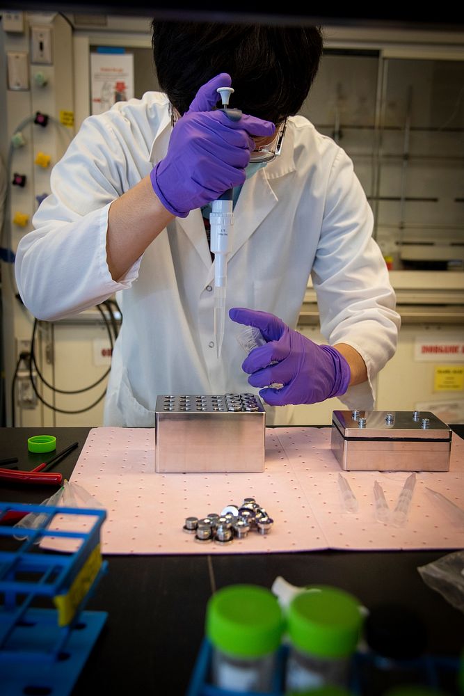 Analytical Process Engineer prepares a prototype HP/HT Well Plate Reactor during a development test by the Engineering Small…