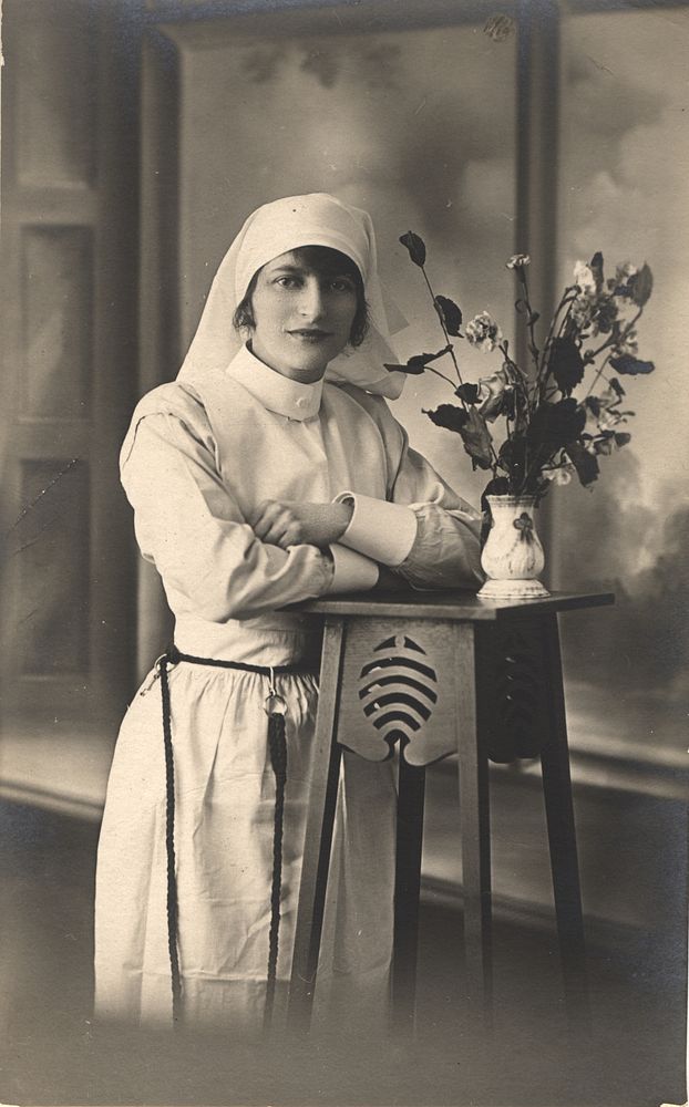 Nurse with a Vase of Flowers.