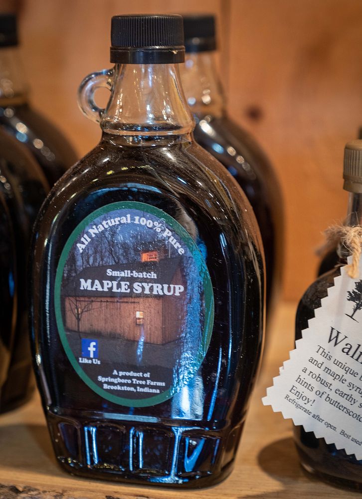 Joe Velovitch pours maple syrup into the finishing pan at Springboro Tree Farms in Brookston, Indiana Feb. 13, 2023.…