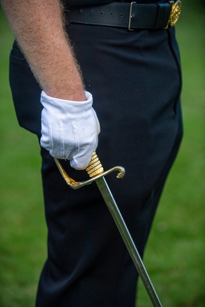  The United States Navy holding sword.