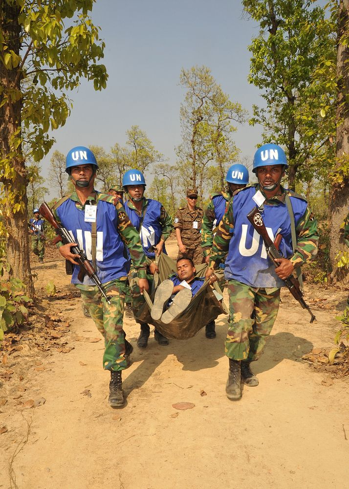 Bangladeshi soldiers transport a squad leader with simulated wounds during exercise Shanti Doot 3 in Bangladesh, March 12…