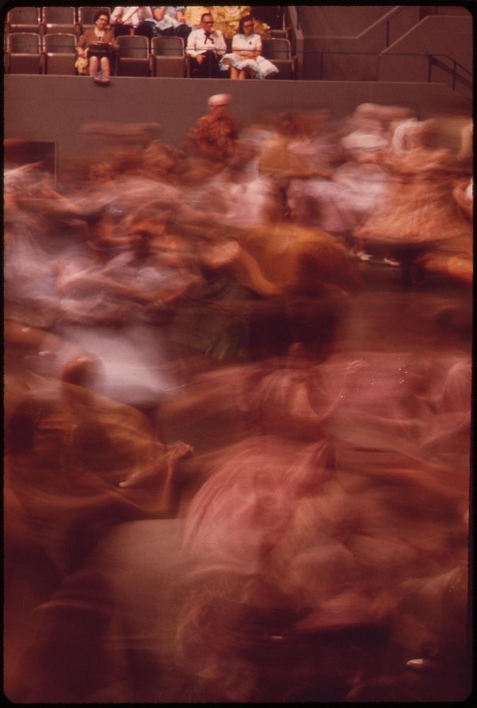 Skirts whirl in the 33rd Annual Square Dance Festival, held in the Pershing Auditorium, May 1973. Photographer: O'Rear…