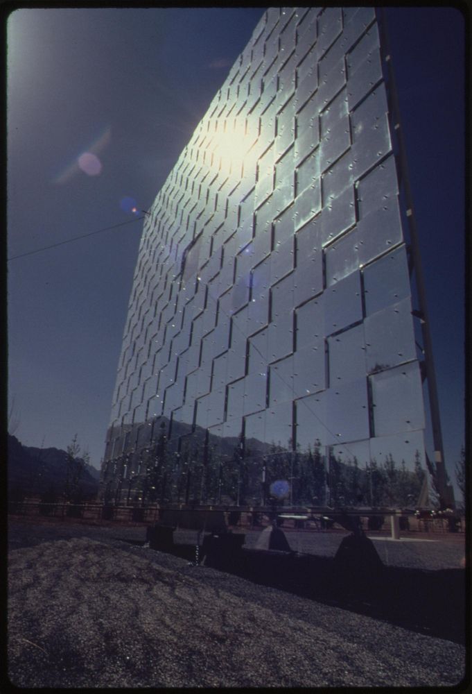 This is a heliostat, a plane surface consisting of many flat mirrors, about 60 feet tall which is part of the solar furnace…