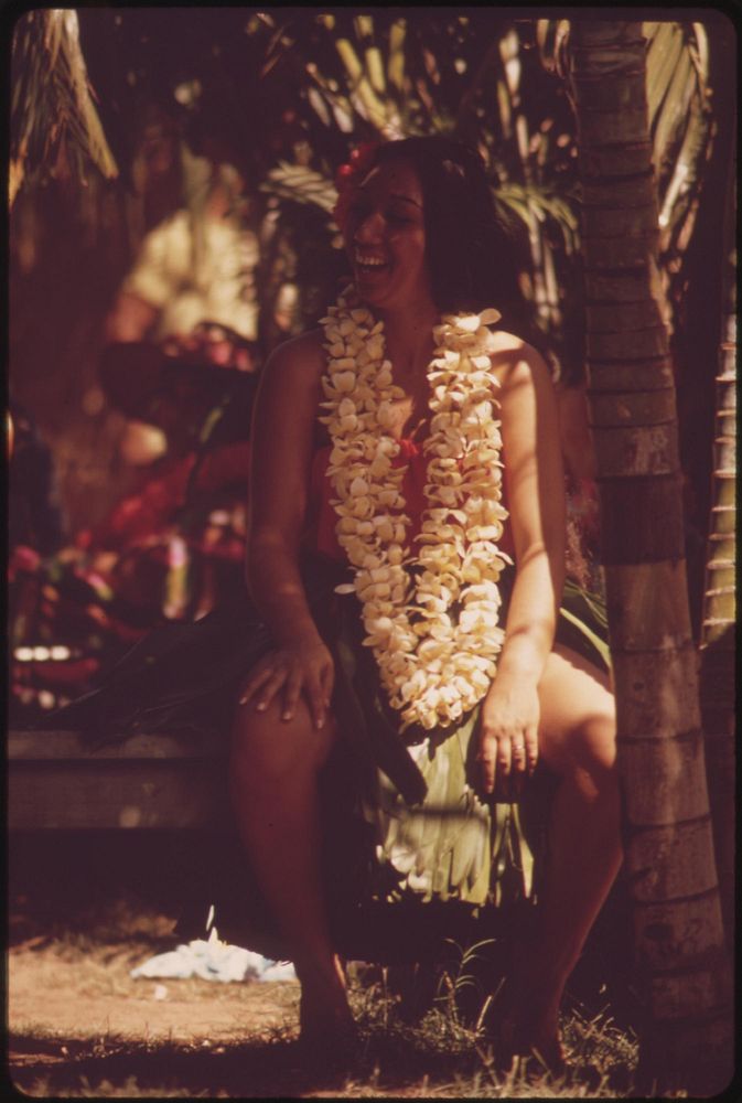 Hawaiian rests after demonstrating hula dance to appreciative Waikiki Beach tourists, October 1973. Photographer: O'Rear…