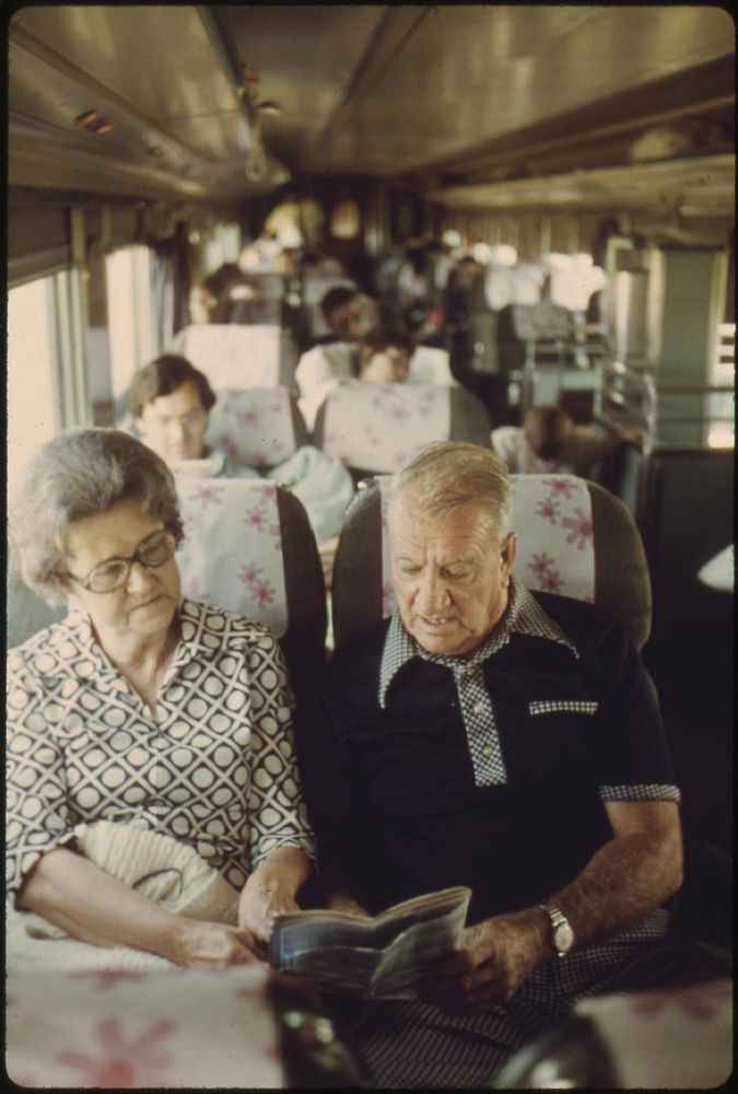 Couple discuss their plans in a passenger car on the Lone Star as it crosses Oklahoma enroute from Chicago to Houston…