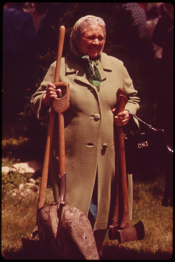 Farm wife with wares at a Saturday auction near Hickman, May 1973. Photographer: O'Rear, Charles. Original public domain…