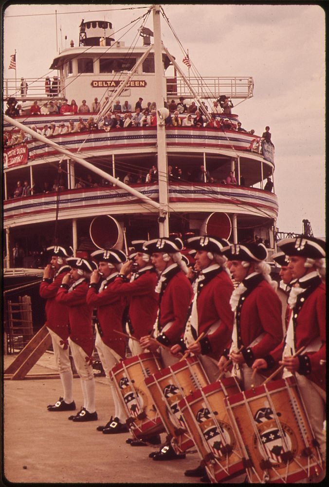 Fife And Drum Corps Perform On Louisville Waterfront, Where Paddlewheel Steamboat Is Docked, May 1972. Photographer: Strode…