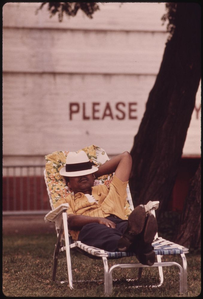 Black Man Enjoying A Nap On A Chaise Lounge On Chicago's South Side, 08/1973. Photographer: White, John H. Original public…