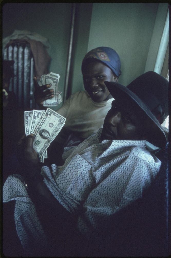 Black Family Count Their Cash In Their Apartment In South Side Chicago, 06/1973. Photographer: White, John H. Original…