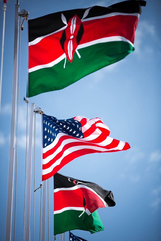 Kenyan national flags and the American Stars and Stripes flutter in the wind outside the Kenyatta International Conference…