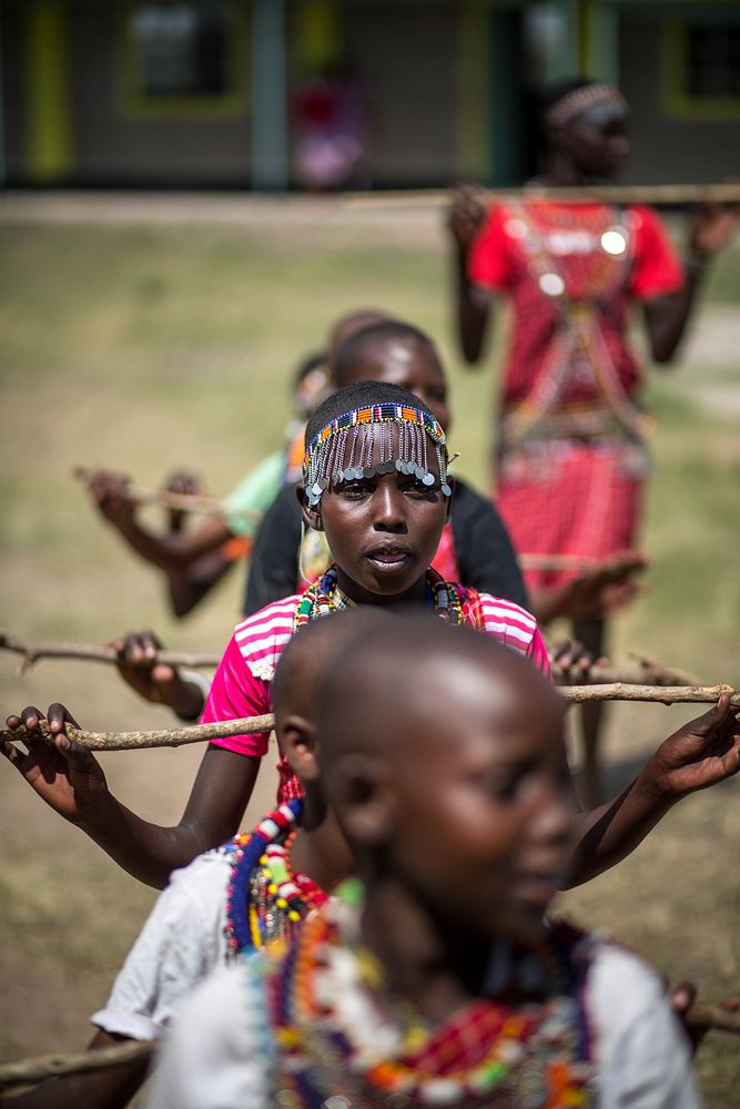 Pupils of the Molibani Primary School located next to the Maasai Mara National Reserve perform traditional Maasai song and…