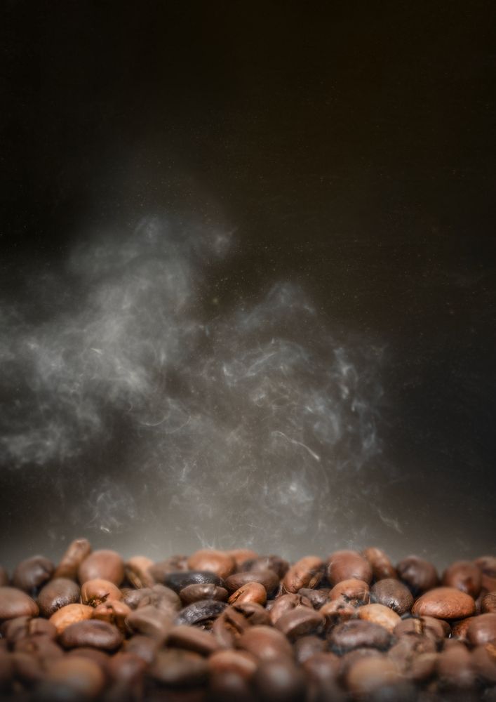 Roasted coffee beans, dark image with copy space