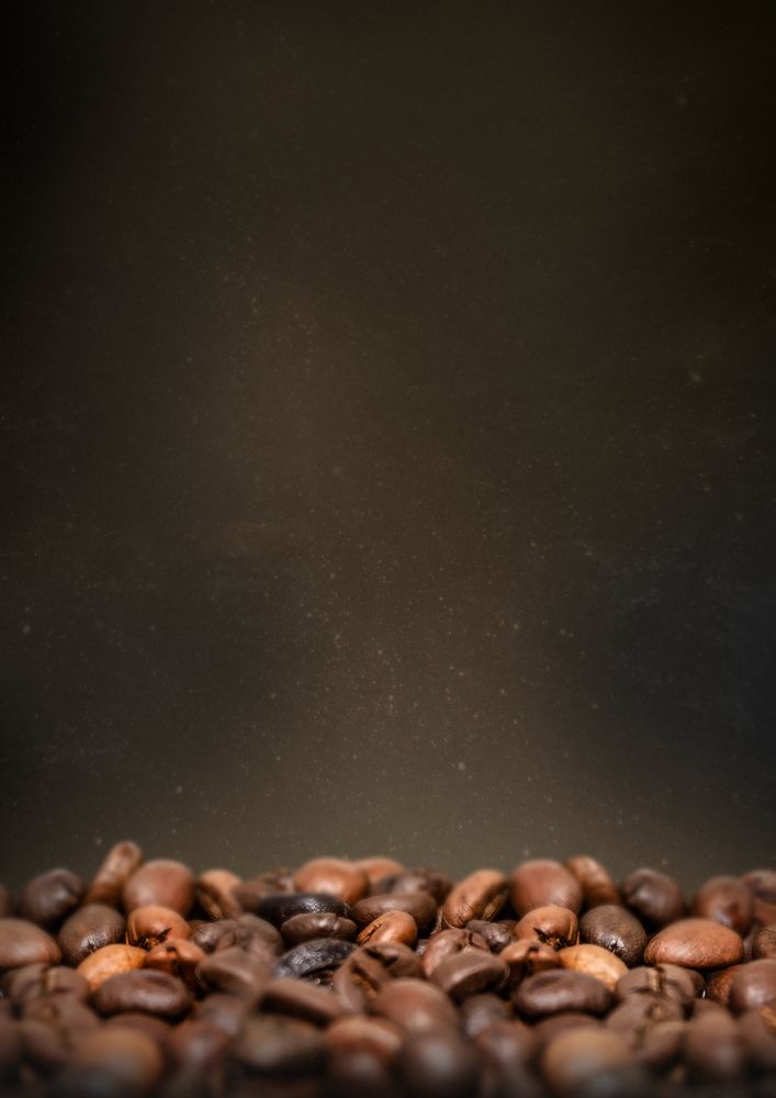 Roasted coffee beans, dark image with copy space