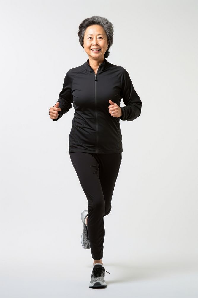 60 years old Asian Senior woman running jogging smiling adult. AI generated Image by rawpixel.