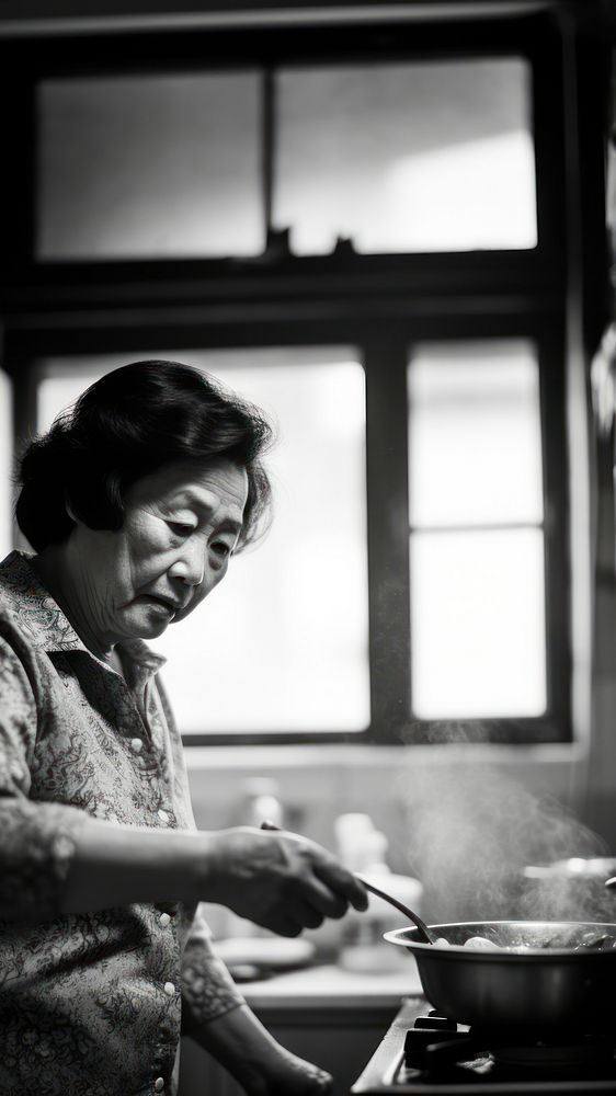 A photo of chinese aunt cooking. AI generated Image by rawpixel. 