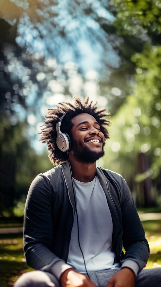 Happy man headphones listening outdoors.  