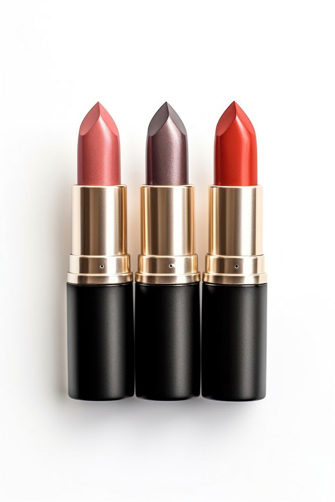 3 lipsticks cosmetics white background ammunition. 