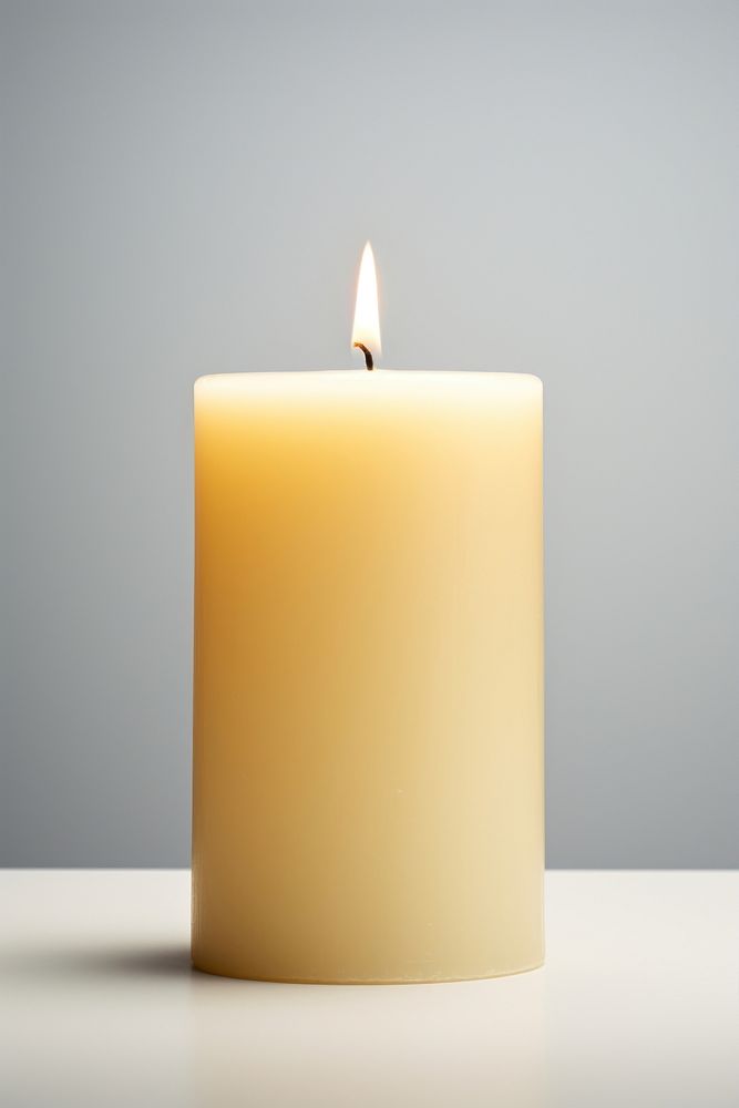 A candle illuminated simplicity cylinder. AI generated Image by rawpixel.