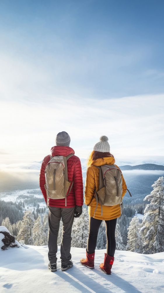 Rear of a Couple hikers with beautiful winter scene. AI generated Image by rawpixel. 