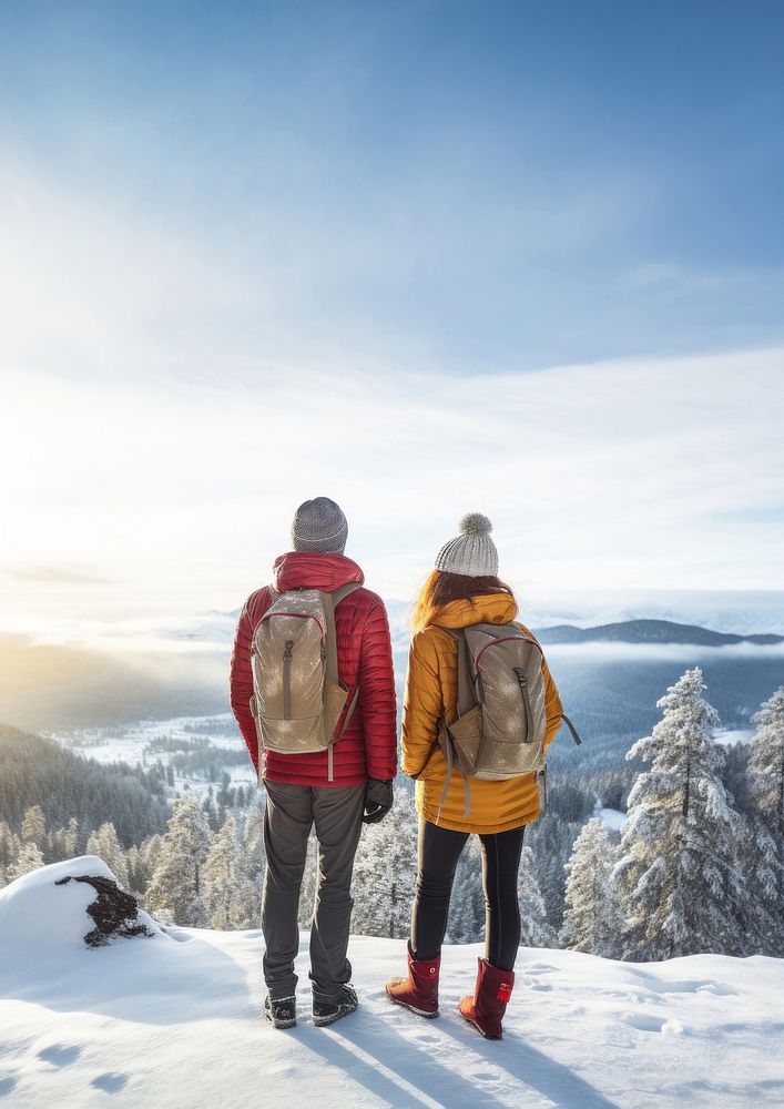 Rear of a Couple hikers with beautiful winter scene. AI generated Image by rawpixel. 