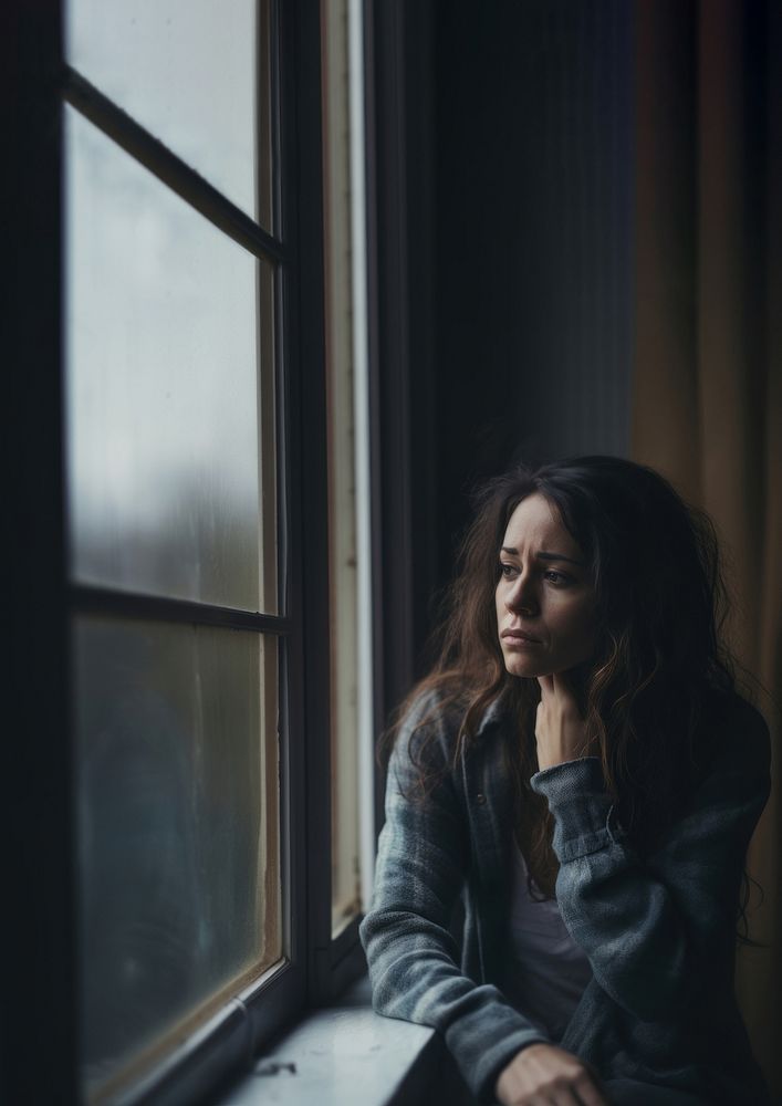 image of sad person looking out window. AI generated Image by rawpixel.