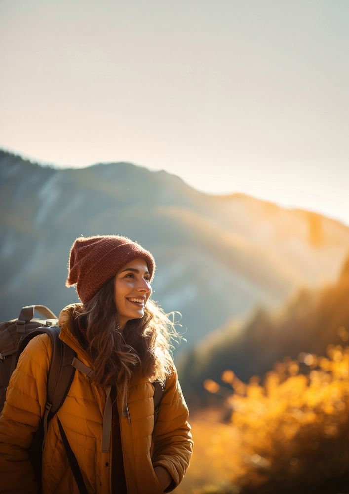 Photo of happy smiling woman hiking in mountains. 