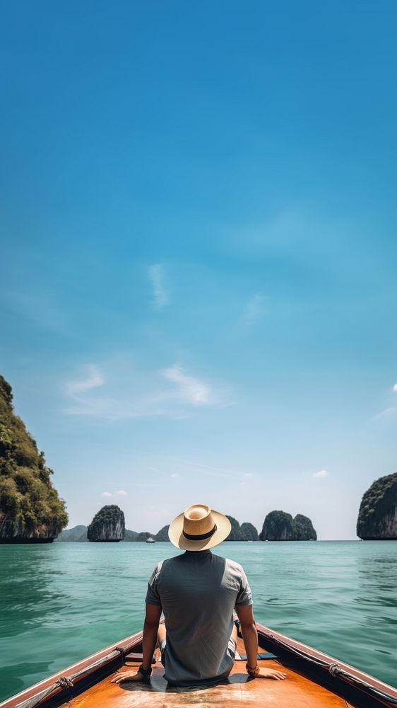 Back view photo of a man sitting in front of a boat, in Krabi in sunny day. AI generated Image by rawpixel.