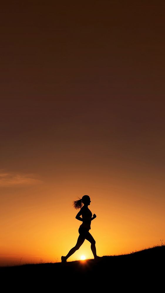 photo of silhouette woman run on the hill with sunset. 