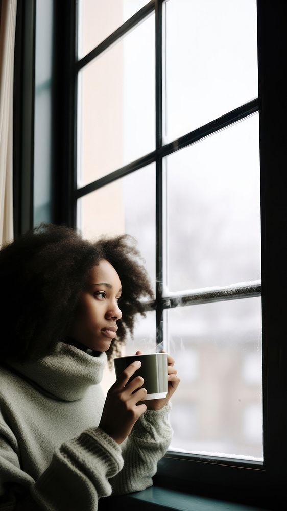 Photo of Thoughtful black woman with coffee cup looking through window in winter season. AI generated Image by rawpixel. 