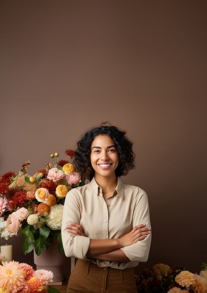 photo of a smiling florist looking at the camera studio shot isolated on a solid background.  