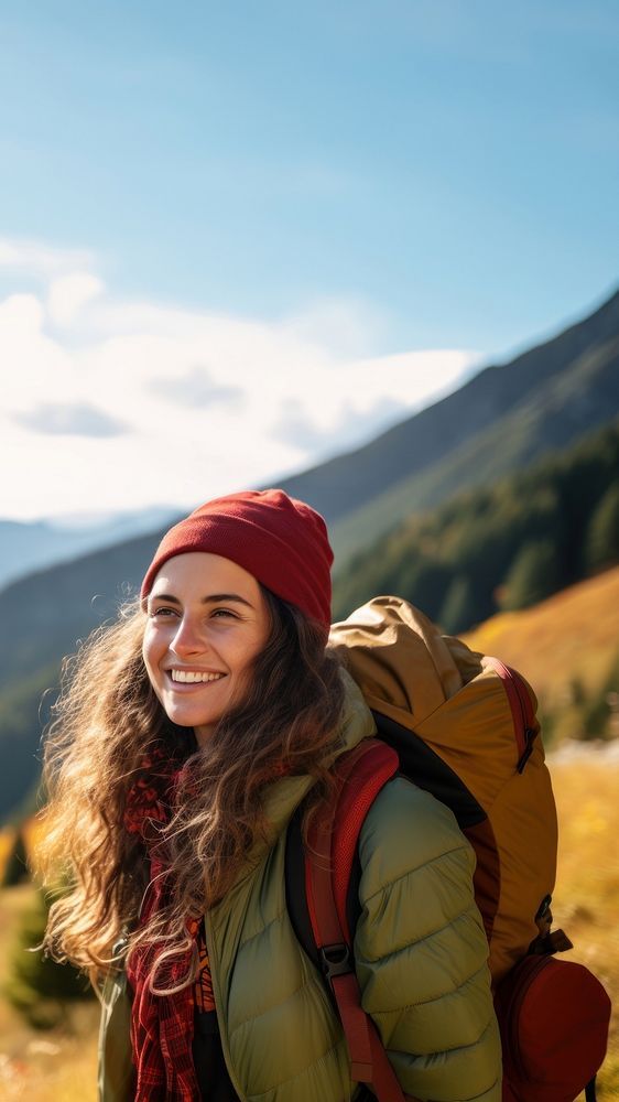 Photo of happy smiling woman hiking in mountains.  