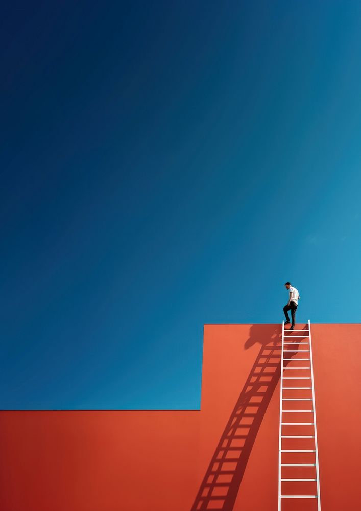 Photography of a man climbing a ladder to the roof.  