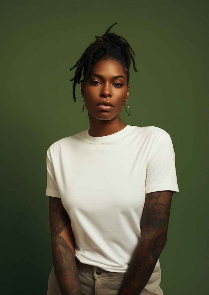 Black woman wearing a white shirt portrait t-shirt tattoo. 