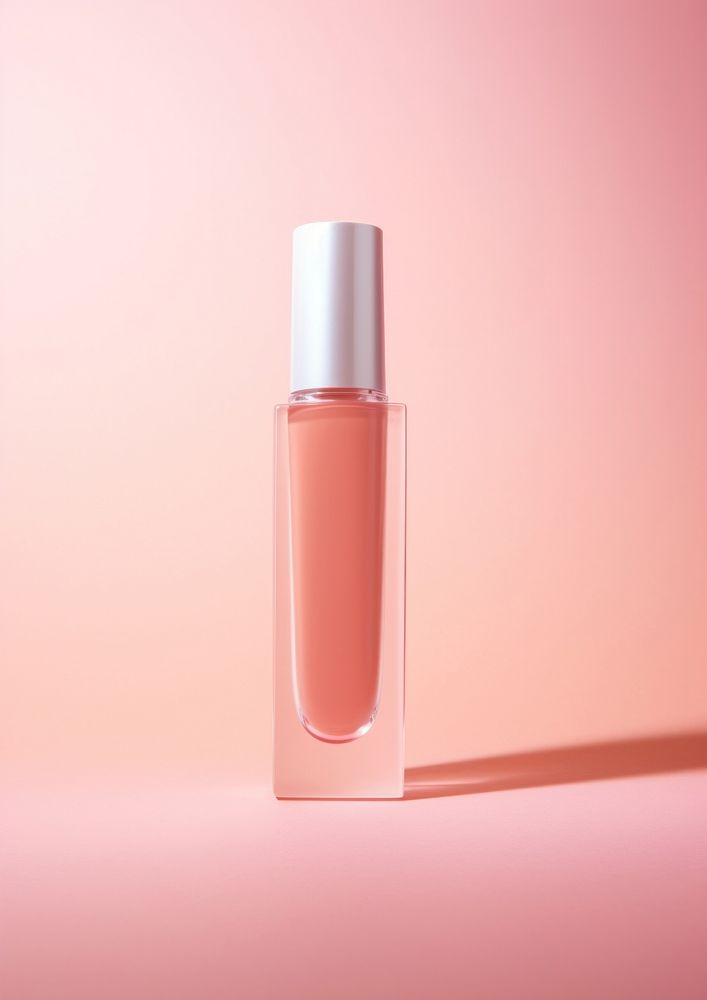 Pink lip gloss bottle cosmetics perfume. 