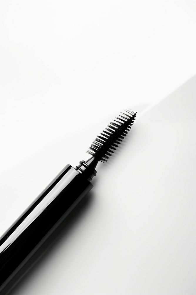 A mascara brush cosmetics black white background. AI generated Image by rawpixel.