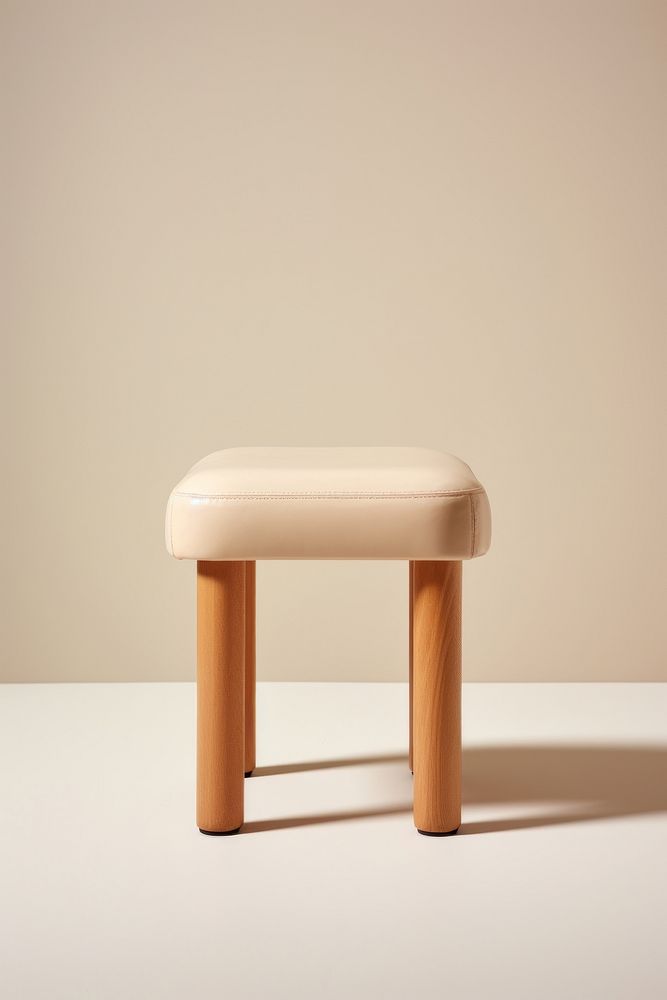Beige padded tate stool furniture simplicity armrest. AI generated Image by rawpixel.