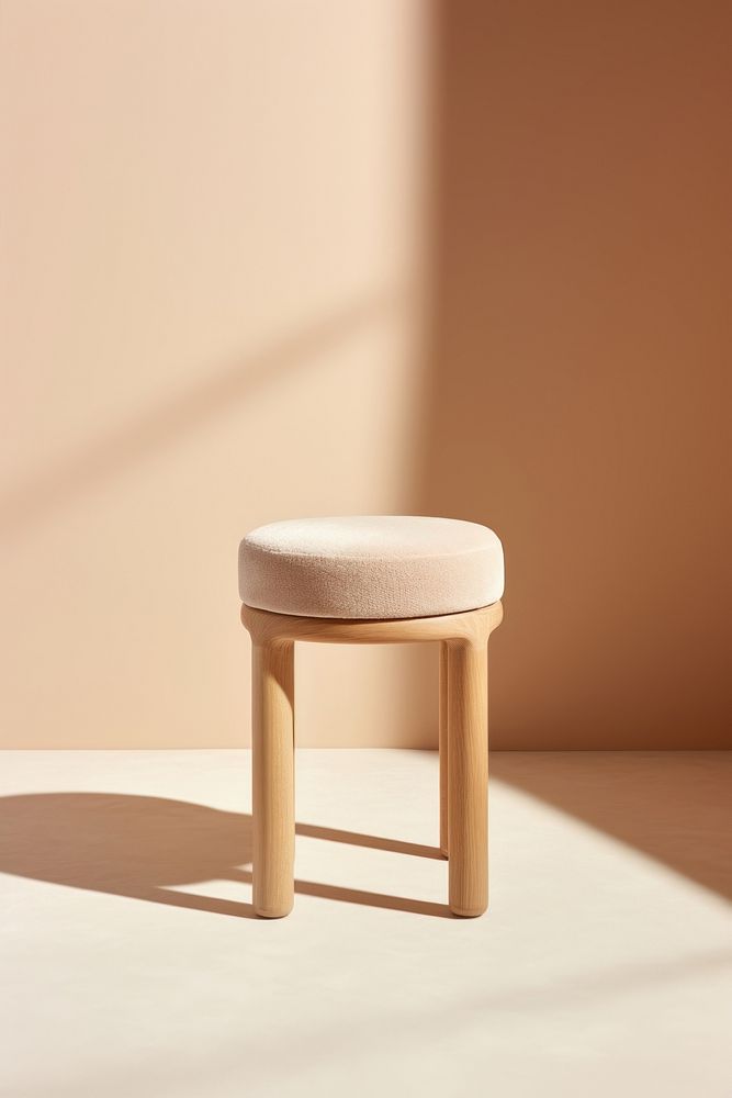 Beige padded tate stool furniture simplicity absence. AI generated Image by rawpixel.