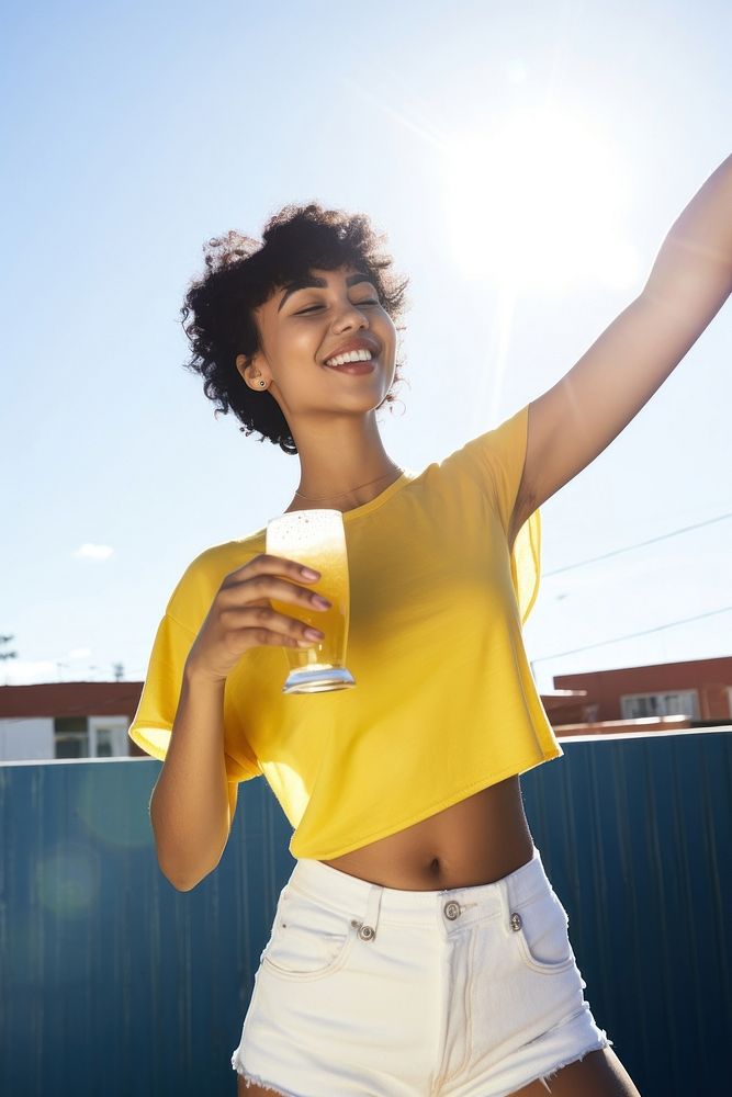 Dancing alone drinking beer shorts sunny smile. AI generated Image by rawpixel.